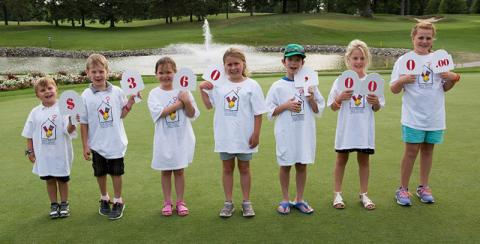 Children holding up numbers